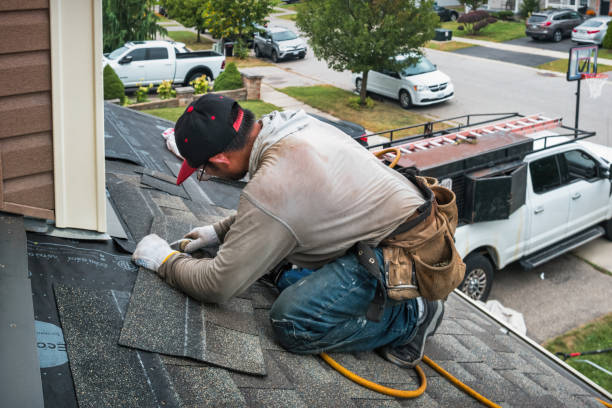 Professional Hail Damage Roof Repair technician working in Grand Forks AFB, ND